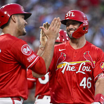 Aug 16, 2024; St. Louis, Missouri, USA;  St. Louis Cardinals first baseman Paul Goldschmidt (46) celebrates with third baseman Nolan Arenado (28) after hitting a two run home run against the Los Angeles Dodgers during the second inning at Busch Stadium. Mandatory Credit: Jeff Curry-Imagn Images