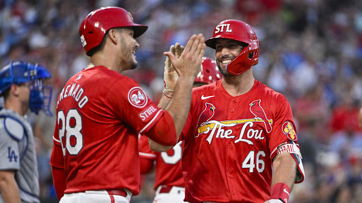 Aug 16, 2024; St. Louis, Missouri, USA;  St. Louis Cardinals first baseman Paul Goldschmidt (46) celebrates with third baseman Nolan Arenado (28) after hitting a two run home run against the Los Angeles Dodgers during the second inning at Busch Stadium. Mandatory Credit: Jeff Curry-Imagn Images