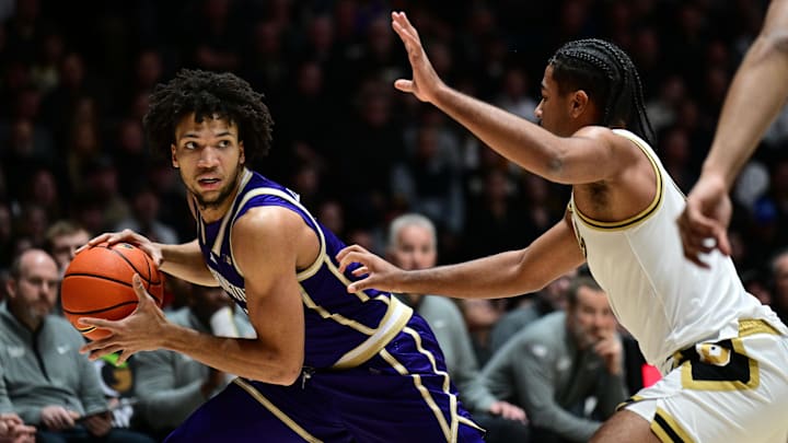 Jan 7, 2026; West Lafayette, Indiana, USA; Washington Huskies guard Desmond Claude (1) looks to get past Purdue Boilermakers guard C.J. Cox (0) during the first half at Mackey Arena. Mandatory Credit: Marc Lebryk-Imagn Images