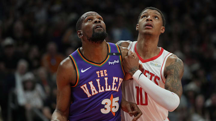 Phoenix Suns forward Kevin Durant and Houston Rockets forward Jabari Smith Jr. fight for position. Phoenix Suns forward Kevin Durant and Houston Rockets forward Jabari Smith Jr. fight for position.