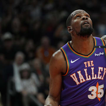 Mar 30, 2025; Phoenix, Arizona, USA; Phoenix Suns forward Kevin Durant (35) and Houston Rockets forward Jabari Smith Jr. (10) fight for position in the first half at Footprint Center. Mandatory Credit: Rick Scuteri-Imagn Images