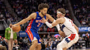 Mar 11, 2025; Detroit, Michigan, USA; Washington Wizards forward Corey Kispert (24) defends against Detroit Pistons guard Cade Cunningham (2) during the second half at Little Caesars Arena. Mandatory Credit: David Reginek-Imagn Images
