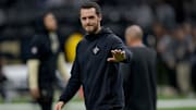 New Orleans Saints quarterback Derek Carr walks the field before a game against the Las Vegas Raiders.