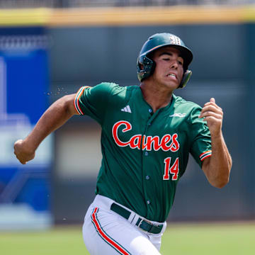 Miami (Fl) Hurricanes infielder Daniel Cuvet (14) runs home in the first inning against the Clemson Tigers during the ACC Baseball Tournament at Truist Field.