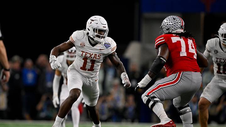 Jan 10, 2025; Arlington, TX, USA; Texas Longhorns linebacker Colin Simmons (11) and Ohio State Buckeyes offensive lineman Donovan Jackson (74) in action during the game between the Texas Longhorns and the Ohio State Buckeyes at AT&T Stadium. Mandatory Credit: Jerome Miron-Imagn Images