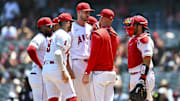 Aug 3, 2025; Anaheim, California, USA; Los Angeles Angels starting pitcher Jack Kochanowicz (41) meets on the mound with teammates against the Chicago White Sox during the first inning at Angel Stadium. Mandatory Credit: Jonathan Hui-Imagn Images