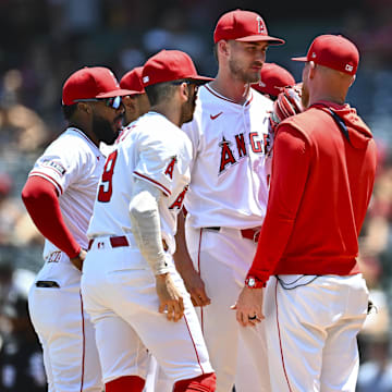 Aug 3, 2025; Anaheim, California, USA; Los Angeles Angels starting pitcher Jack Kochanowicz (41) meets on the mound with teammates against the Chicago White Sox during the first inning at Angel Stadium. Mandatory Credit: Jonathan Hui-Imagn Images
