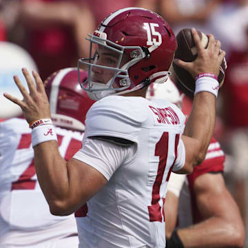 Sep 14, 2024; Madison, Wisconsin, USA;  Alabama Crimson Tide quarterback Ty Simpson (15) throws a pass during the fourth quarter against the Wisconsin Badgers at Camp Randall Stadium. Mandatory Credit: Jeff Hanisch-Imagn Images