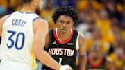 Apr 26, 2025; San Francisco, California, USA; Houston Rockets forward Amen Thompson (1) defends against Golden State Warriors guard Stephen Curry (30) during the third quarter of game three of first round for the 2024 NBA Playoffs at Chase Center. Mandatory Credit: Darren Yamashita-Imagn Images