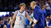 Dec 2, 2025; Lexington, Kentucky, USA; Kentucky Wildcats guard Collin Chandler (5) talks with head coach Mark Pope during the second half at Rupp Arena at Central Bank Center. Mandatory Credit: Jordan Prather-Imagn Images