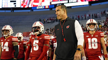 Oct 26, 2024; Madison, Wisconsin, USA;  Wisconsin Badgers head coach Luke Fickell walks onto the field during warmups prior to the game against the Penn State Nittany Lions at Camp Randall Stadium. Mandatory Credit: Jeff Hanisch-Imagn Images