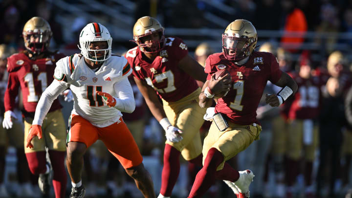 Nov 24, 2023; Chestnut Hill, Massachusetts, USA; Boston College Eagles quarterback Thomas Castellanos (1) runs for a touchdown against the Miami Hurricanes during the second half at Alumni Stadium. Mandatory Credit: Brian Fluharty-USA TODAY Sports