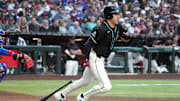 Mar 29, 2025; Phoenix, Arizona, USA; Arizona Diamondbacks outfielder Jake McCarthy (31) hits an RBI ground out against the Chicago Cubs in the second inning at Chase Field. Mandatory Credit: Rick Scuteri-Imagn Images