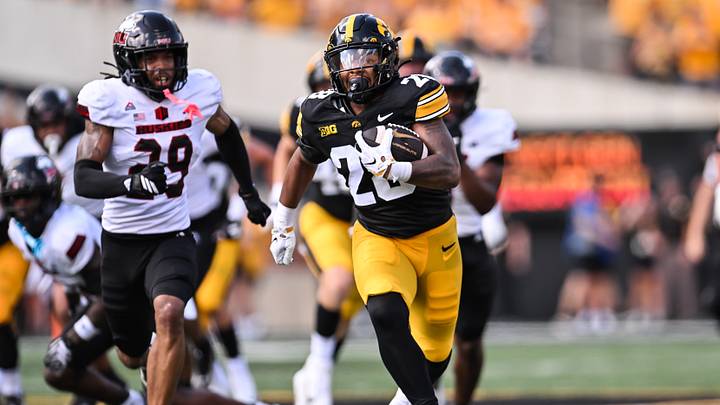 Sep 5, 2026; Iowa City, Iowa, USA;  Iowa Hawkeyes running back Kamari Moulton (28) runs for a 66 yard touchdown as Northern Illinois Huskies cornerback Romelo Walker (29) pursues during the first quarter at Kinnick Stadium.  Mandatory Credit: Jeffrey Becker-Imagn Images