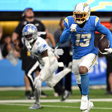 Los Angeles Chargers wide receiver Keenan Allen runs the ball for a touchdown after a catch against the Detroit Lions.