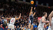 Gonzaga Bulldogs guard Ryan Nembhard (0) shoots a three-point shot against St. Mary's Gaels guard Mikey Lewis (0). 