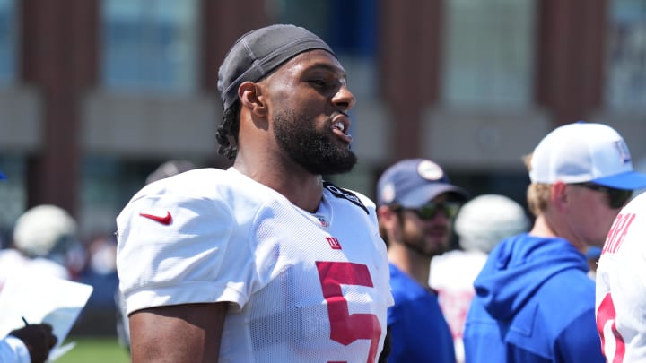 Jul 26, 2024; East Rutherford, NJ, USA; New York Giants linebacker Kayvon Thibodeaux (5) speaks on the sideline during Quest Diagnostics Training Center training camp.  