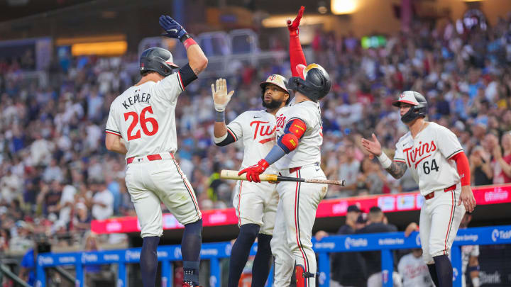 Aug 13, 2024; Minneapolis, Minnesota, USA; Minnesota Twins outfielder Max Kepler (26) celebrates his home run with first baseman Carlos Santana (30) and catcher Christian Vazquez (8) against the Kansas City Royals in the sixth inning at Target Field. Mandatory Credit: Brad Rempel-USA TODAY Sports