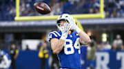 Oct 26, 2025; Indianapolis, Indiana, USA; Indianapolis Colts tight end Tyler Warren (84) warms up before the game against the Tennessee Titans at Lucas Oil Stadium. 