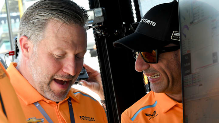 McLaren CEO Zak Brown talks with Tony Kanaan on Friday, May 24, 2024, during Carb Day ahead of the 108th running of the Indianapolis 500 at Indianapolis Motor Speedway.