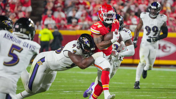 Sep 5, 2024; Kansas City, Missouri, USA; Kansas City Chiefs running back Samaje Perine (34) runs the ball as Baltimore Ravens defensive tackle Travis Jones (98) makes the tackle during the second half at GEHA Field at Arrowhead Stadium. Mandatory Credit: Denny Medley-Imagn Images Sep 5, 2024; Kansas City, Missouri, USA; Kansas City Chiefs running back Samaje Perine (34) runs the ball as Baltimore Ravens defensive tackle Travis Jones (98) makes the tackle during the second half at GEHA Field at Arrowhead Stadium. Mandatory Credit: Denny Medley-Imagn Images