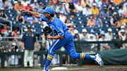 Jun 14, 2025; Omaha, Neb, USA;  UCLA Bruins pitcher Easton Hawk (27) throws against the Murray State Racers during the ninth inning at Charles Schwab Field. Mandatory Credit: Steven Branscombe-Imagn Images