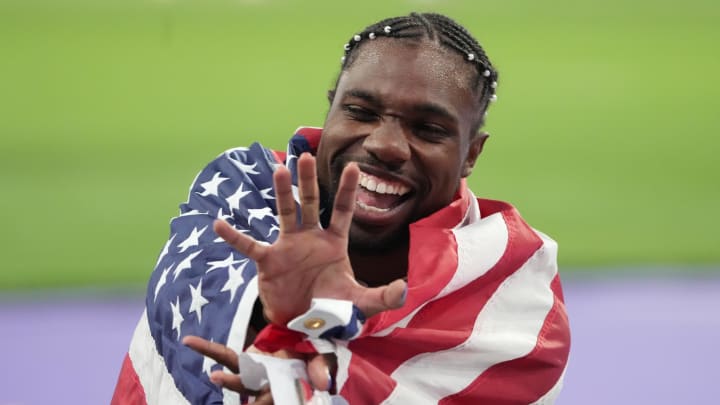 Aug 4, 2024; Paris, FRANCE; Noah Lyles (USA) celebrates winning the men's 100m final during the Paris 2024 Olympic Summer Games at Stade de France. Mandatory Credit: Kirby Lee-USA TODAY Sports