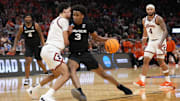 Mar 21, 2025; Milwaukee, WI, USA: Xavier Musketeers guard Dailyn Swain (3) drives to the hoop past Illinois Fighting Illini forward Will Riley (7) during the second half at Fiserv Forum.