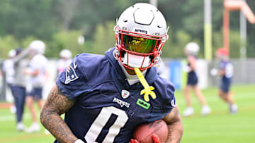 Jun 9, 2025; Foxborough, MA, USA; New England Patriots cornerback Christian Gonzalez (0) runs after the catch during minicamp at Gillette Stadium. Mandatory Credit: Eric Canha-Imagn Images