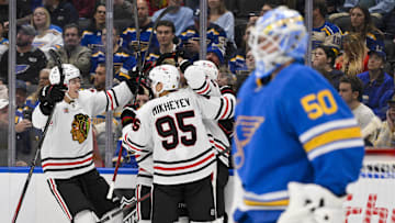 Oct 15, 2025; St. Louis, Missouri, USA; Chicago Blackhawks center Jason Dickinson (16) is congratulated by teammates after scoring against St. Louis Blues goaltender Jordan Binnington (50) during the second period at Enterprise Center. Mandatory Credit: Jeff Curry-Imagn Images