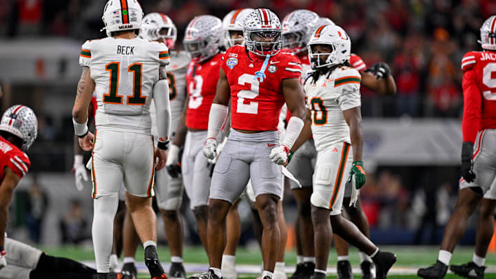 Dec 31, 2025; Arlington, TX, USA; Ohio State Buckeyes safety Caleb Downs (2) celebrates a defensive stop during the 2025 Cotton Bowl and quarterfinal game of the College Football Playoff at AT&T Stadium. Mandatory Credit: Jerome Miron-Imagn Images