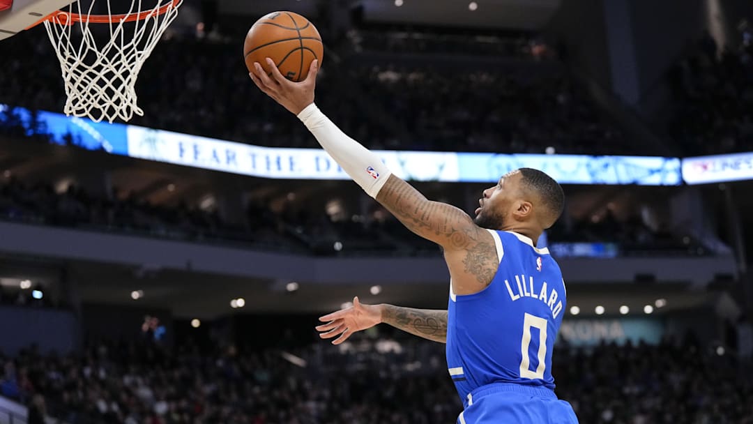 Mar 15, 2025; Milwaukee, Wisconsin, USA;   Milwaukee Bucks guard Damian Lillard (0) shoots during the third quarter against the Indiana Pacers at Fiserv Forum. Mandatory Credit: Jeff Hanisch-Imagn Images