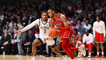 Feb 12, 2025; Villanova, Pennsylvania, USA; Saint John's Red Storm guard Jaiden Glover (11) drives against Villanova Wildcats guard Jhamir Brickus (2) in the first half at William B. Finneran Pavilion. Mandatory Credit: Kyle Ross-Imagn Images