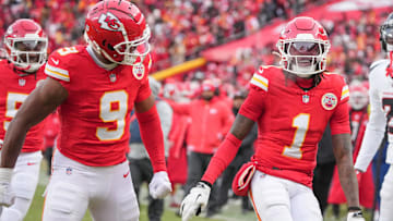 Jan 18, 2025; Kansas City, Missouri, USA; Kansas City Chiefs wide receiver Xavier Worthy (1) celebrates with wide receiver JuJu Smith-Schuster (9) after a play against the Houston Texans during the first half of a 2025 AFC divisional round game at GEHA Field at Arrowhead Stadium. Mandatory Credit: Denny Medley-Imagn Images
