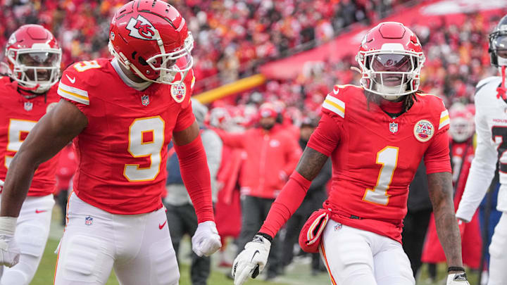 Jan 18, 2025; Kansas City, Missouri, USA; Kansas City Chiefs wide receiver Xavier Worthy (1) celebrates with wide receiver JuJu Smith-Schuster (9) after a play against the Houston Texans during the first half of a 2025 AFC divisional round game at GEHA Field at Arrowhead Stadium. Mandatory Credit: Denny Medley-Imagn Images