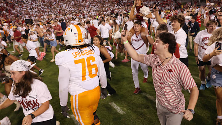 Oct 5, 2024; Fayetteville, Arkansas, USA; Arkansas Razorbacks fans run onto the field after the game against the Tennessee Volunteers at Donald W. Reynolds Razorback Stadium. Arkansas won 19-14. Mandatory Credit: Nelson Chenault-Imagn Images