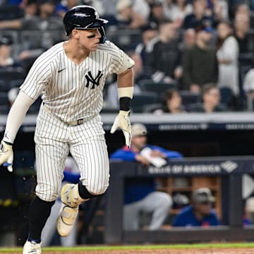 May 16, 2025; Bronx, New York, USA; New York Yankees outfielder Aaron Judge (99) hits a single against the New York Mets during the eighth inning at Yankee Stadium. Mandatory Credit: John Jones-Imagn Images
