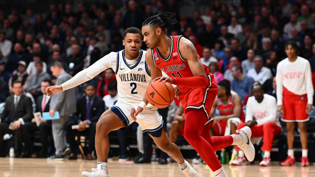 Feb 12, 2025; Villanova, Pennsylvania, USA; St. John's basketball guard Jaiden Glover (11) drives against Villanova Wildcats guard Jhamir Brickus (2) in the first half at William B. Finneran Pavilion. 