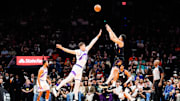 Oct 31, 2025; Phoenix, Arizona, USA; Phoenix Suns guard Devin Booker (1) shoots a three-point shot in the first half between the Phoenix Suns and the Utah Jazz at Mortgage Matchup Center. Mandatory Credit: Arianna Grainey-Imagn Images