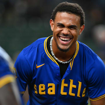 Seattle Mariners center fielder Julio Rodriguez (right) celebrates after with Randy Arozarena (left) after a walk-off win against the Texas Rangers on Saturday at T-Mobile Park.