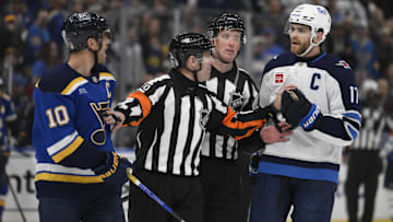 Apr 27, 2025; St. Louis, Missouri, USA; St. Louis Blues center Brayden Schenn (10) talks to Winnipeg Jets center Adam Lowry (17) during the third period in game four of the first round of the 2025 Stanley Cup Playoffs at Enterprise Center. Mandatory Credit: Jeff Le-Imagn Images