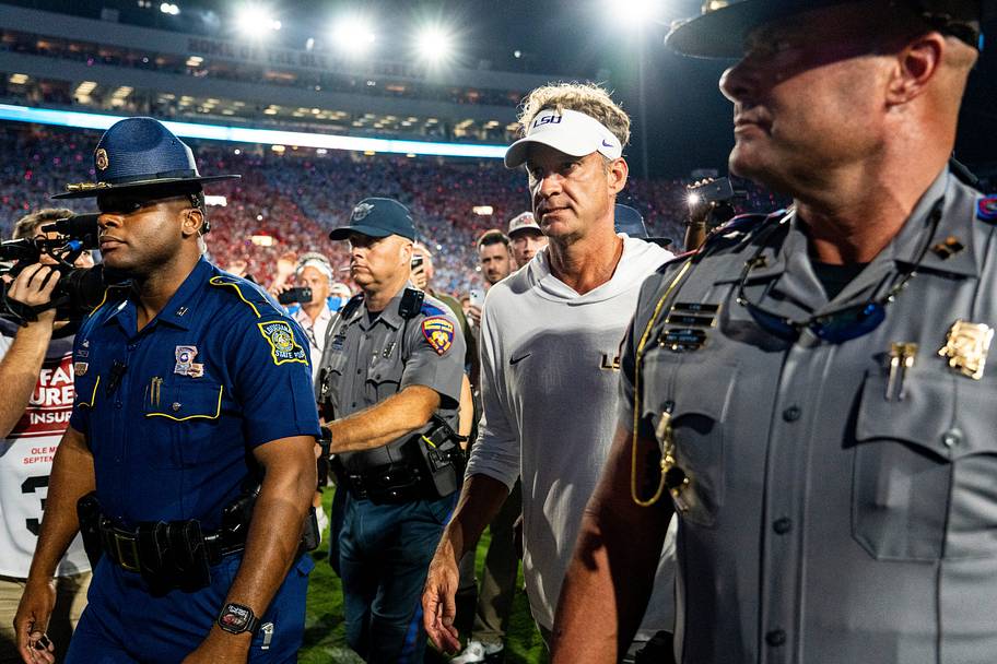 LSU coach Lane Kiffin walks off the field after losing to Ole Miss.