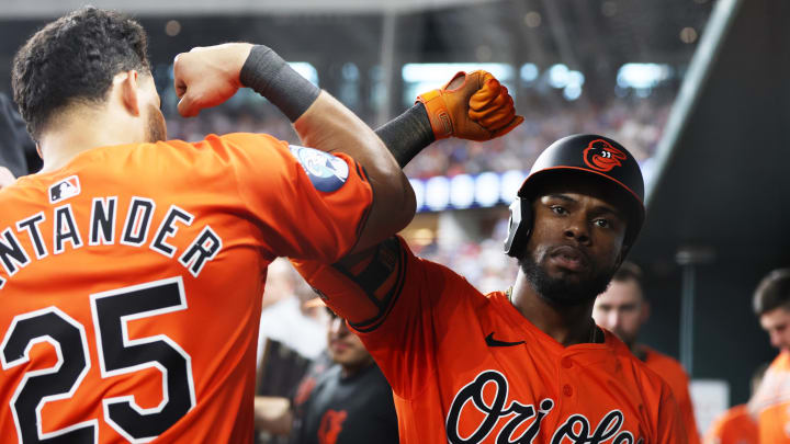 Jul 20, 2024; Arlington, Texas, USA; Baltimore Orioles center fielder Cedric Mullins (31) celebrates with designated hitter Anthony Santander (25) in the dugout after hitting a home run against the Texas Rangers in the third inning at Globe Life Field