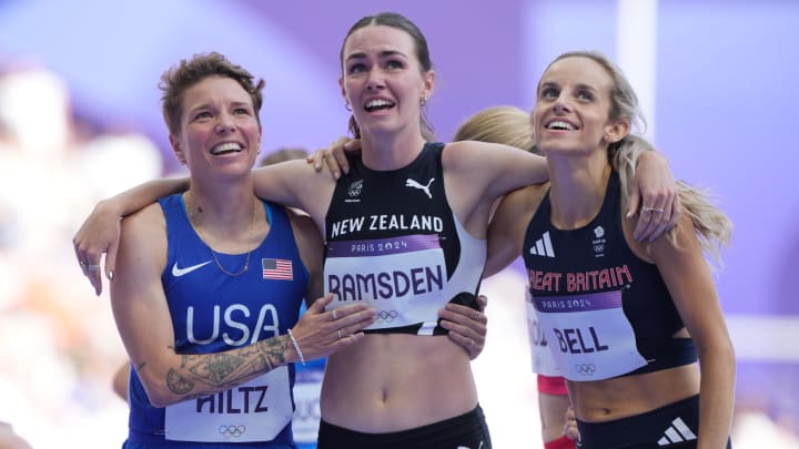 Georgia Bell, right, celebrates advancing in the 1,500 meters