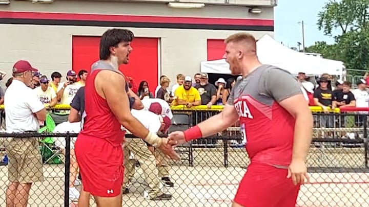 Nixa's Jackson Cantwell (left) is congratulated by junior teammate Hayden Mays while officials in the background mark the spot after Cantwell's throw in the MSHSAA Championships on Saturday, May 31, 2025, at Adkins Stadium in Jefferson City, Missouri. The throw wound up becoming No. 2 all-time in NFHS history, missing Michael Carter's national mark of 77-0 by a centimeter. Nixa's Jackson Cantwell (left) is congratulated by junior teammate Hayden Mays while officials in the background mark the spot after Cantwell's throw in the MSHSAA Championships on Saturday, May 31, 2025, at Adkins Stadium in Jefferson City, Missouri. The throw wound up becoming No. 2 all-time in NFHS history, missing Michael Carter's national mark of 77-0 by a centimeter.
