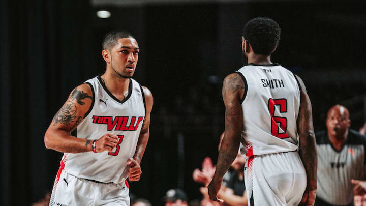 The Ville guards Peyton Siva (3) and Russ Smith (6)