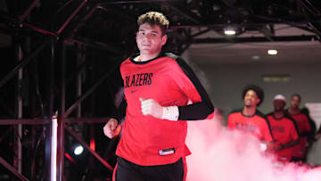 Nov 13, 2024; Portland, Oregon, USA; Portland Trail Blazers center Donovan Clingan (23) runs through the tunnel before the game against the Minnesota Timberwolves at Moda Center. Mandatory Credit: Soobum Im-Imagn Images