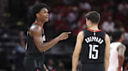 Nov 14, 2025; Houston, Texas, USA;  Houston Rockets guard Amen Thompson (1) talks with guard Reed Sheppard (15) during the fourth quarter against the Portland Trail Blazers at Toyota Center. Mandatory Credit: Troy Taormina-Imagn Images