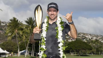 January 12, 2025; Honolulu, Hawaii, USA; Nick Taylor celebrates with the trophy during the final round of the Sony Open golf tournament at Waialae Country Club. Mandatory Credit: Kyle Terada-Imagn Images