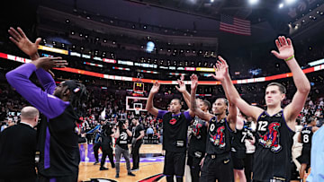 Apr 9, 2025; Toronto, Ontario, CAN; Toronto Raptors forward Scottie Barnes (4) and guard A.J. Lawson (0) acknowledge the crowd after a game against the Charlotte Hornets at Scotiabank Arena. Mandatory Credit: Nick Turchiaro-Imagn Images
